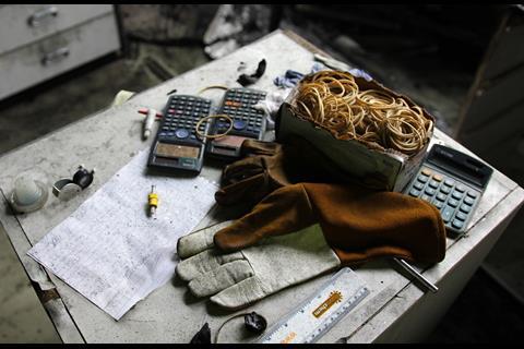 A picture showing gloves and calculators in the fire aftermath